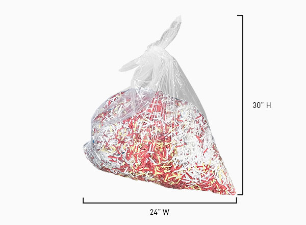 An image of a bag full of shredded paper with dimensions